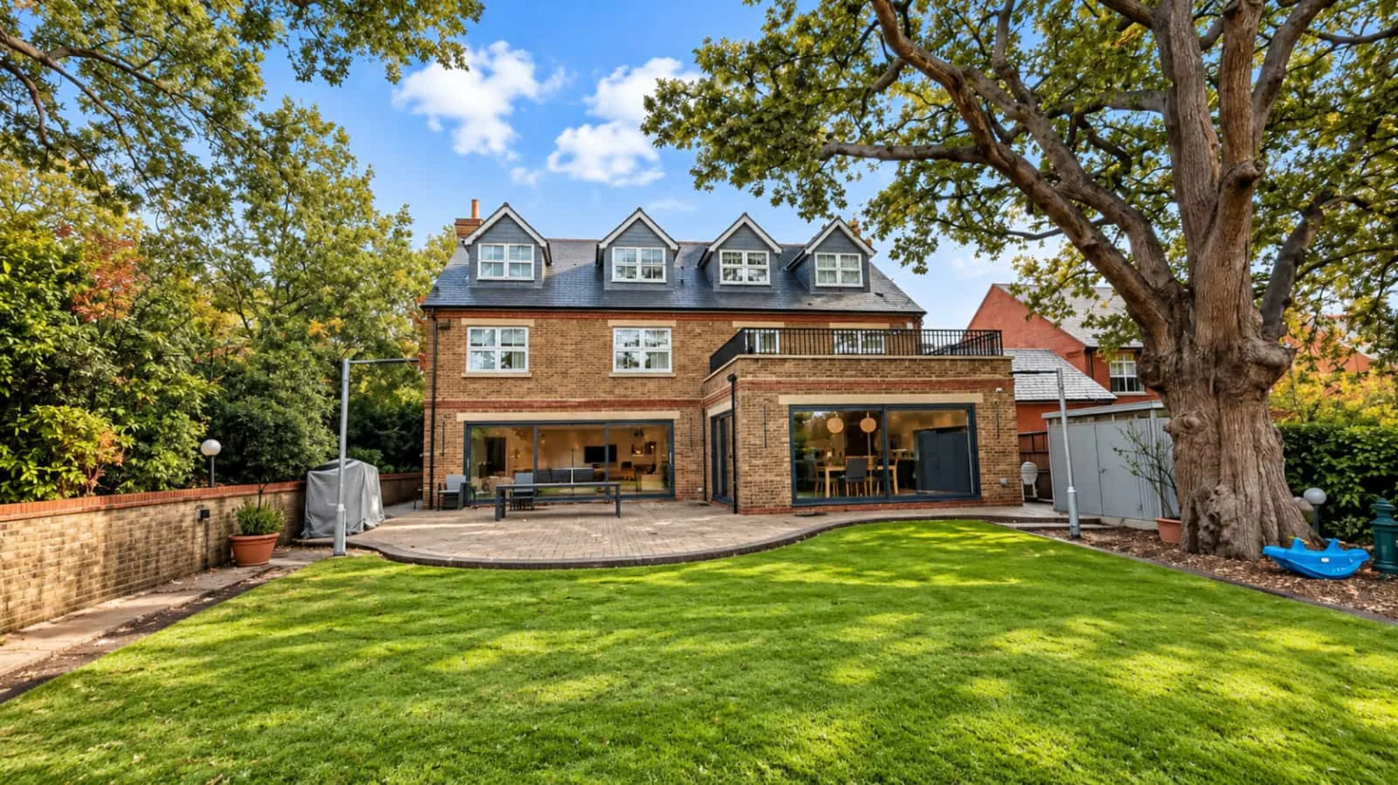Rear extension and roof terrace on a large detached house in Woodford Green